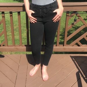 Skinny black lace up high rise pants